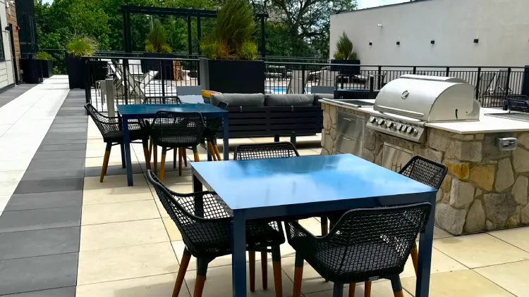 Patio installation and outdoor living space construction with natural stone hardscaping in Waite Hill