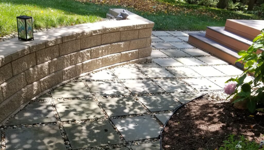 Mulched planting bed with native shrubs and ornamental tree installation in Waite Hill