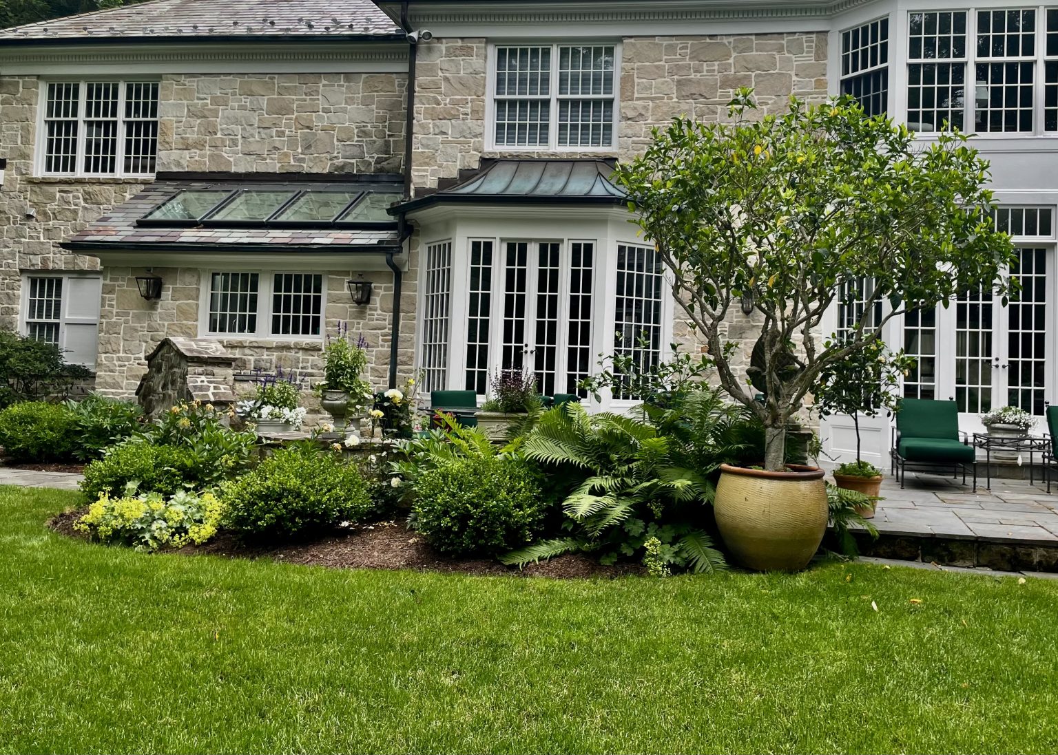 a rear yard in hunting valley maintained by Carmel Landscapes of Middlefield Ohio