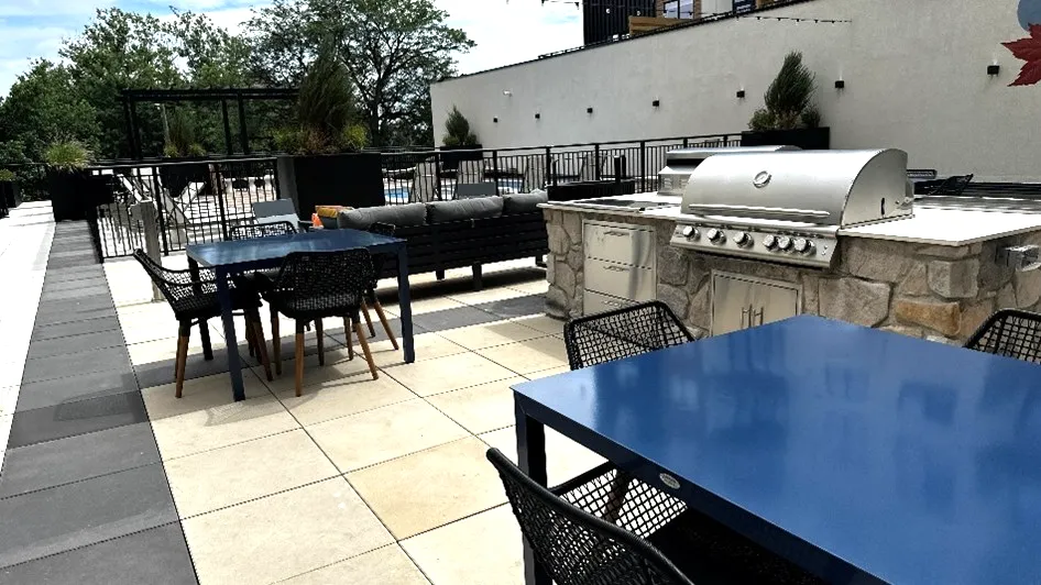 A rooftop outdoor kitchen installed by Carmel Landscapes professional patio contractors and outdoor living space builders based in Northeast Ohio